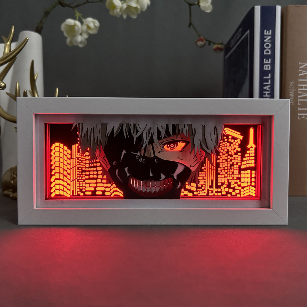 The Tokyo Ghoul Anime Light Box showcases Kaneki Ken with a mask and an eye exposed, featuring dynamic color-changing effects against a red-lit cityscape, enhanced by books and decor.