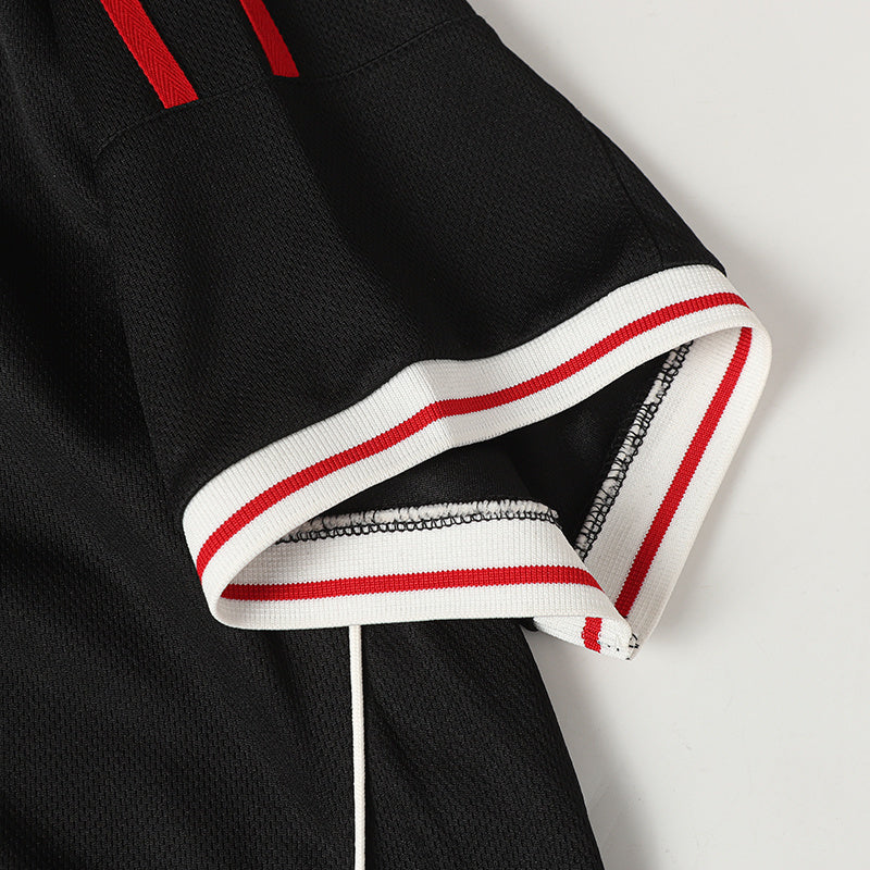Black football polo jersey with red-and-white striped sleeve cuffs and textured athletic fabric detail