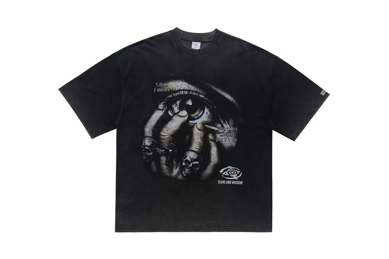 Black oversized graphic tee with a gothic eye and skull hand print, featuring Tears and Wisdom text on the chest