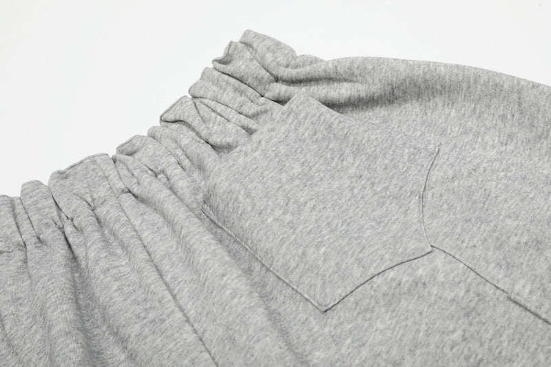 Gray front pocket and waistband detail on wide lounge shorts
