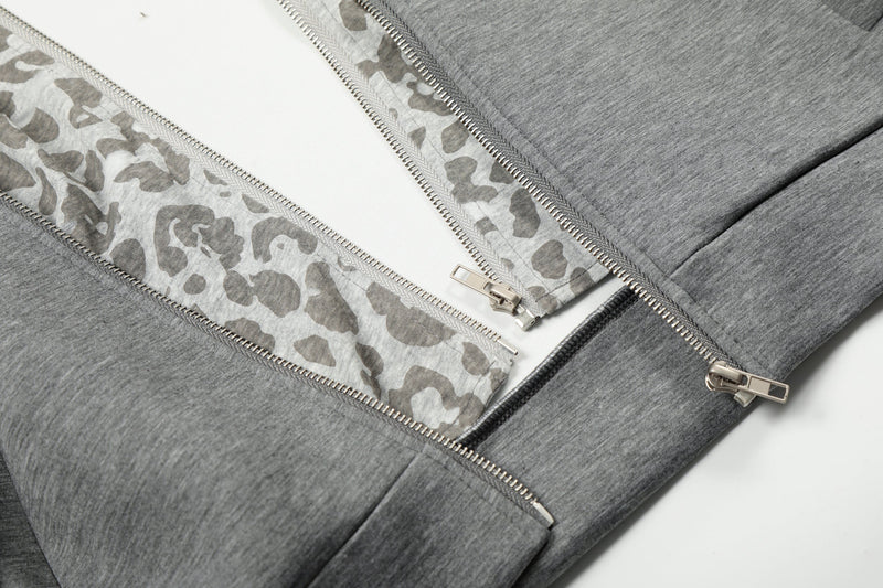 Close-up of grey hoodie front zipper and leopard-print trim