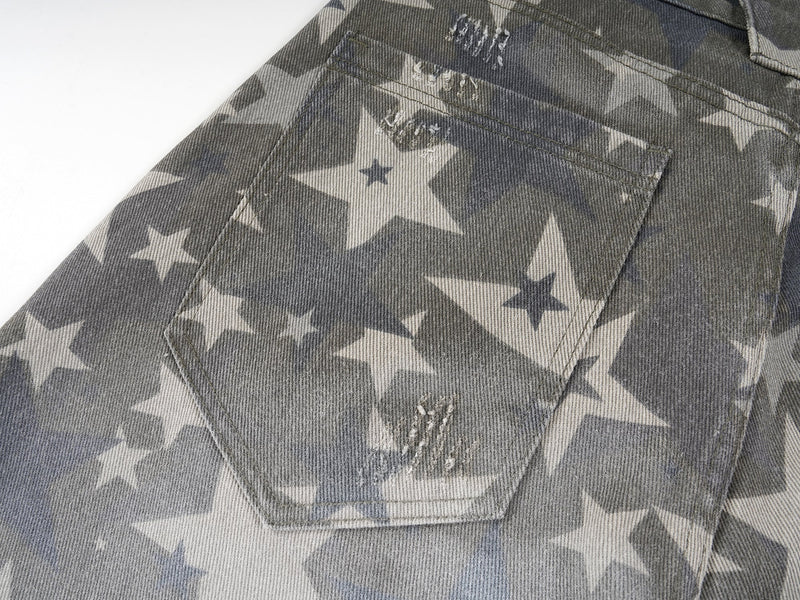 Back pocket close-up on gray star print washed denim pants