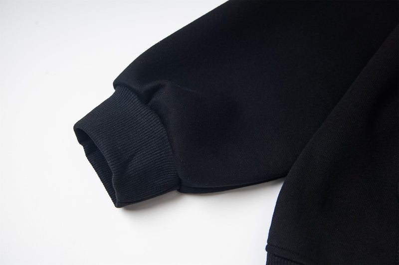 Black sleeve cuff with ribbed knit trim