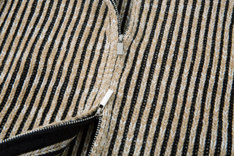 Close-up of the front zipper on the striped ribbed knit jacket
