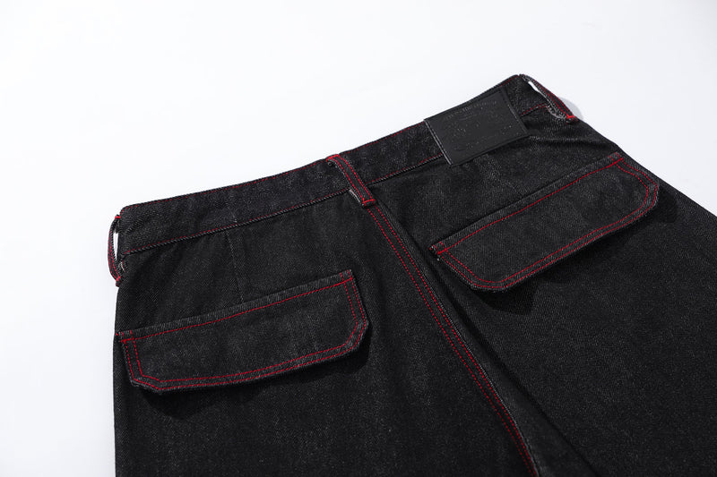 Close-up of back waistband and patch on black denim cargo pants