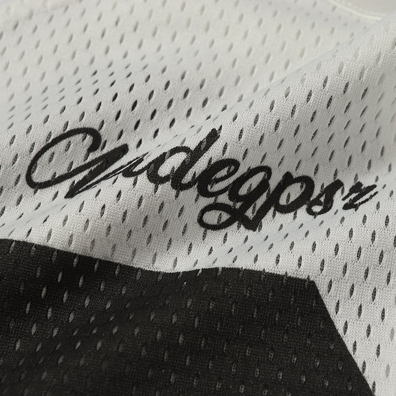 Close-up of a white mesh football jersey with black Madegpsr script and number 06 print