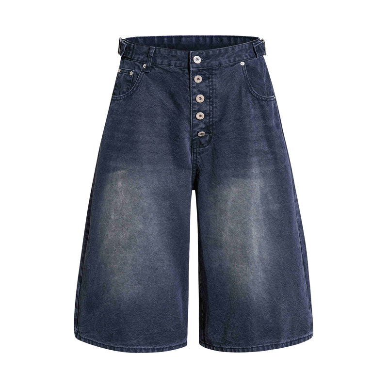 Front view of dark wash wide-leg denim shorts with button fly and front pockets