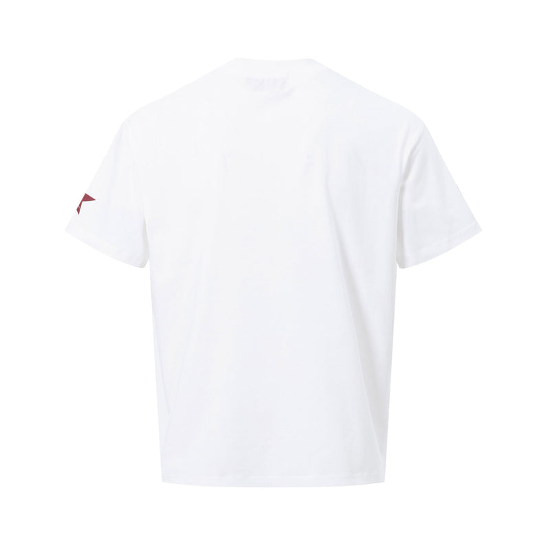White vintage panel graphic tee with a small red accent on the sleeve, shown from the back in a clean streetwear style