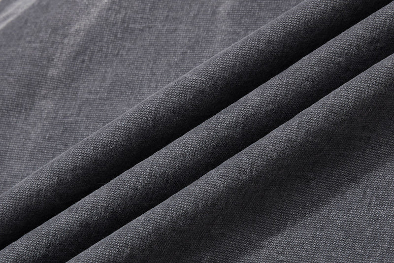 Close-up of charcoal denim fabric drape and texture