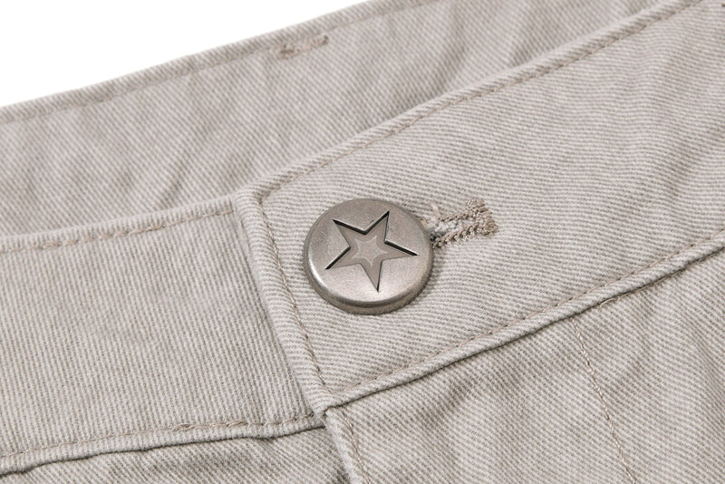 Close-up of beige waistband button on cargo pants