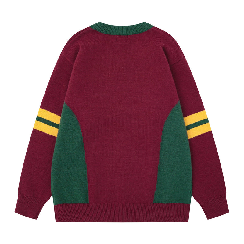 Back view of burgundy knit sweater with green collar, green side panels, and yellow-striped sleeves