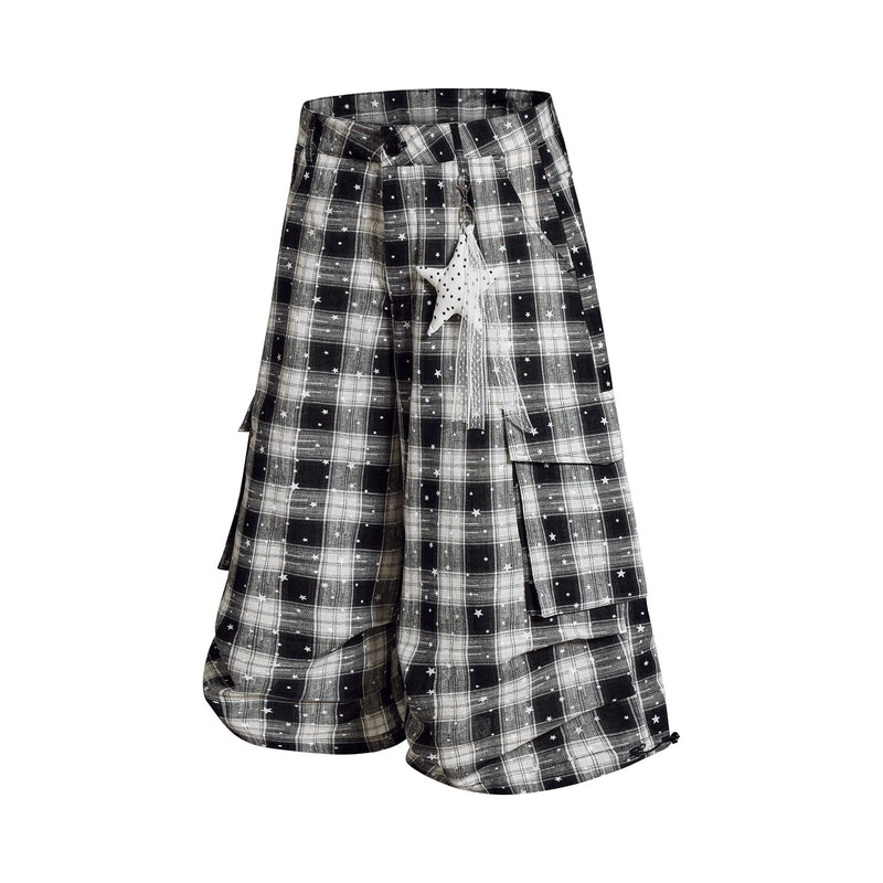 Black and white plaid cargo shorts with star print, angled front view with hanging charm