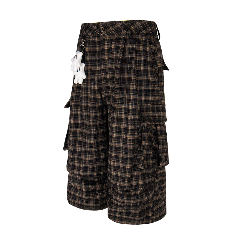 Angled front view of plaid cargo shorts with side cargo pockets and wide legs