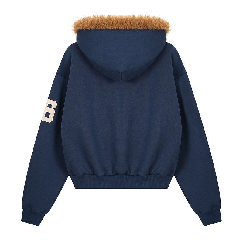 Back of navy zip hoodie with tan faux fur trim on the hood and ribbed cuffs