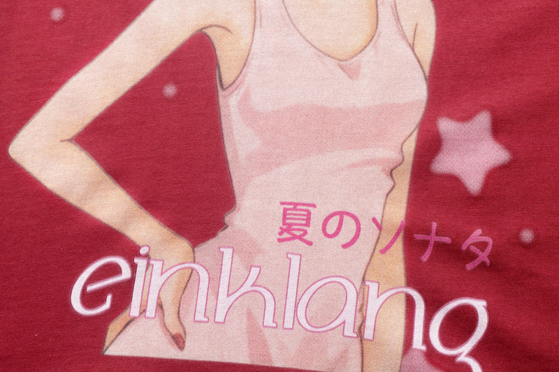 Close-up of anime girl torso print on red front panel with pink text