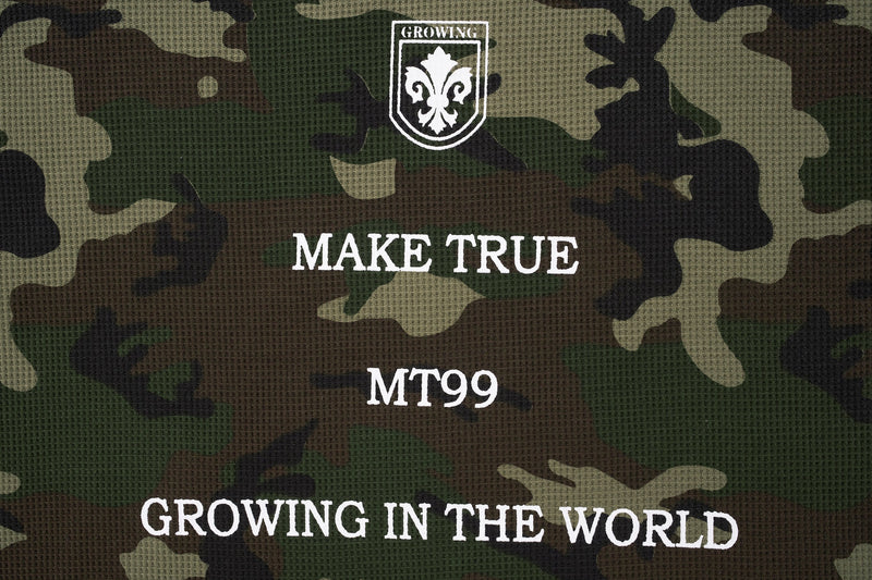Close-up of front chest graphic on camo sweatshirt with white lettering