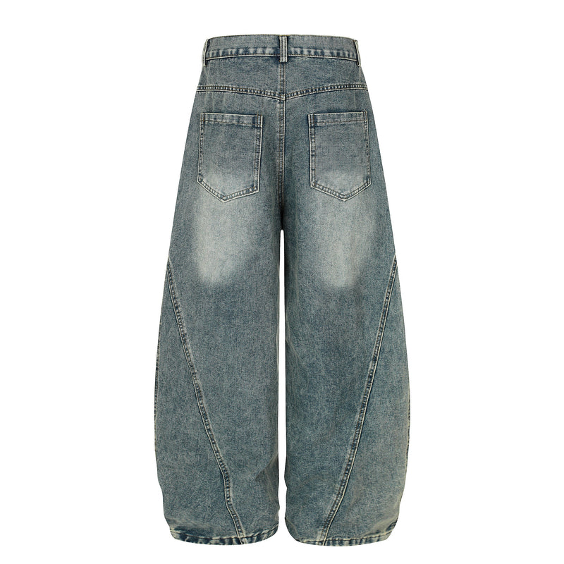 Back view of blue wide-leg denim jeans with faded wash and back pockets