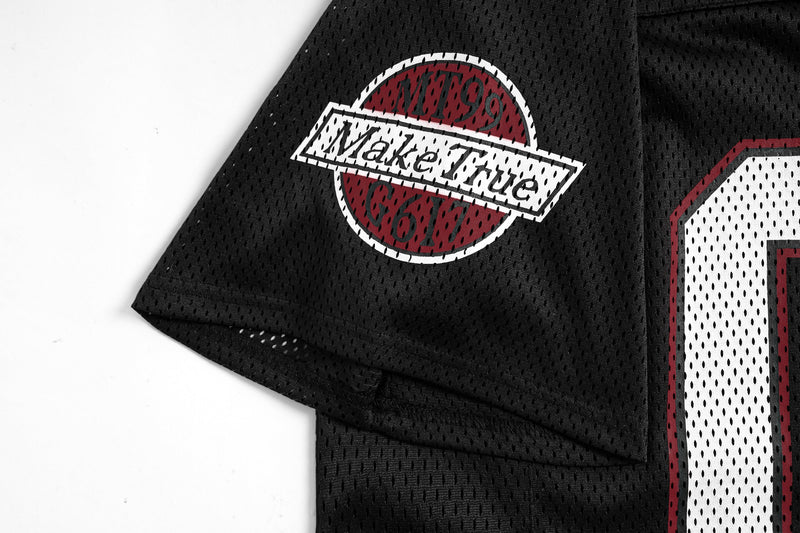 Black mesh football jersey sleeve with Seakoff logo patch and white-red graphic details on breathable fabric