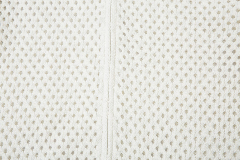 Close-up of white open-knit fabric and center seam on the back panel