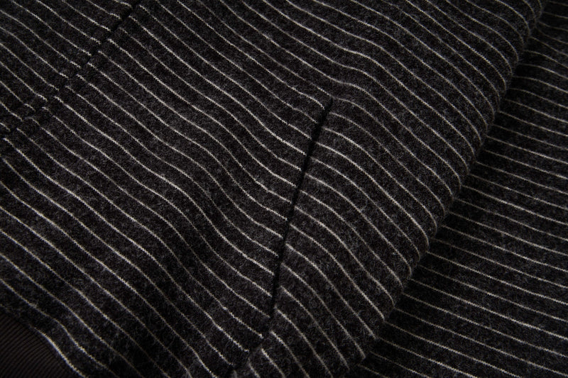 Close-up of black striped knit side panel with diagonal stripe pattern