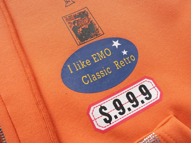 Close-up of printed patches reading I like EMO Classic Retro and $9.9.9