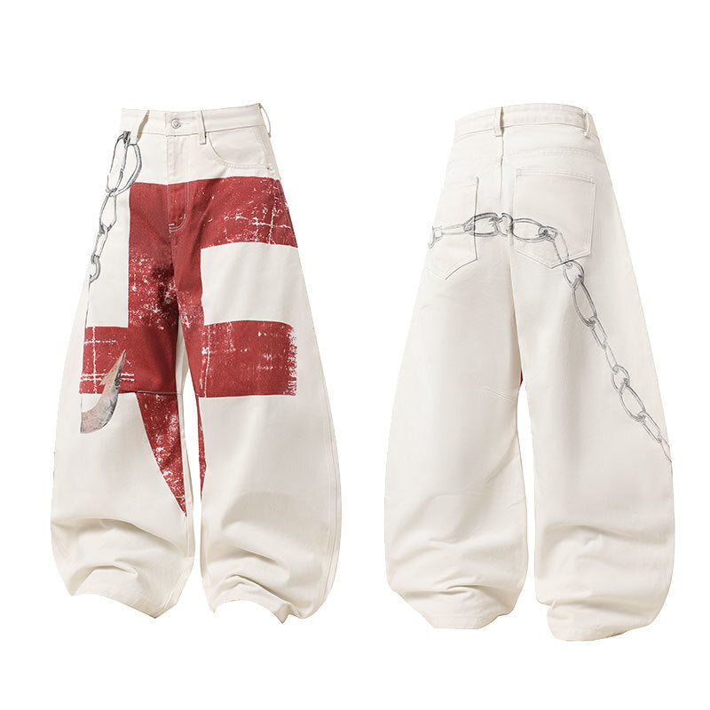 White oversized barrel jeans with large distressed red cross graphic on front and printed chain detail on back