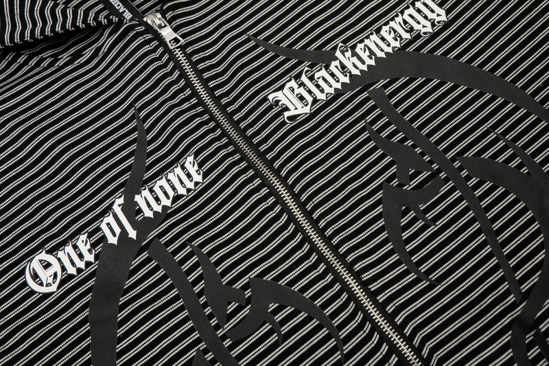 Close-up of front graphic and zipper on black striped hoodie