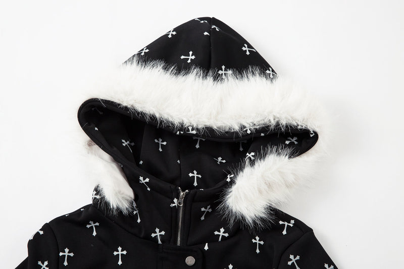 Close-up of black faux fur hood with white trim and cross print