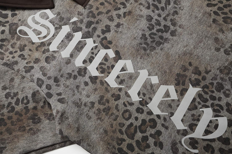 Oversized leopard print polo tee with gothic Seakoff logo on textured gray streetwear shirt