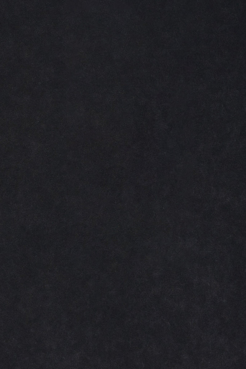 Close-up of black washed cotton fabric with a soft textured finish for a boxy streetwear T-shirt