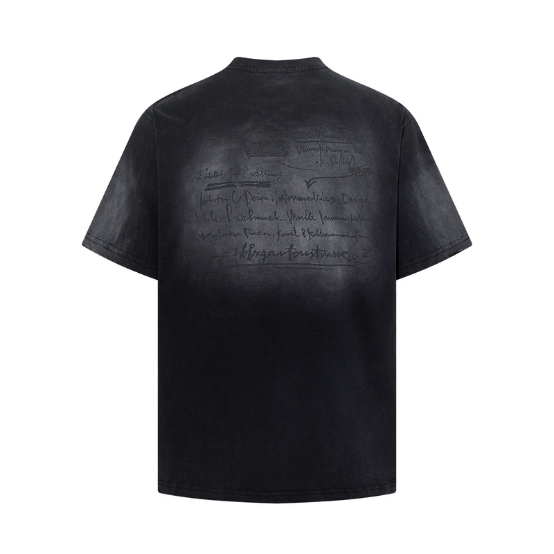Black washed graphic tee with faded handwritten back print and vintage distressed finish