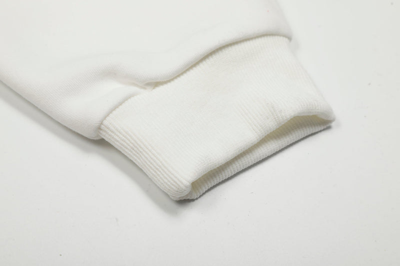 Close-up of white ribbed cuff on hoodie sleeve
