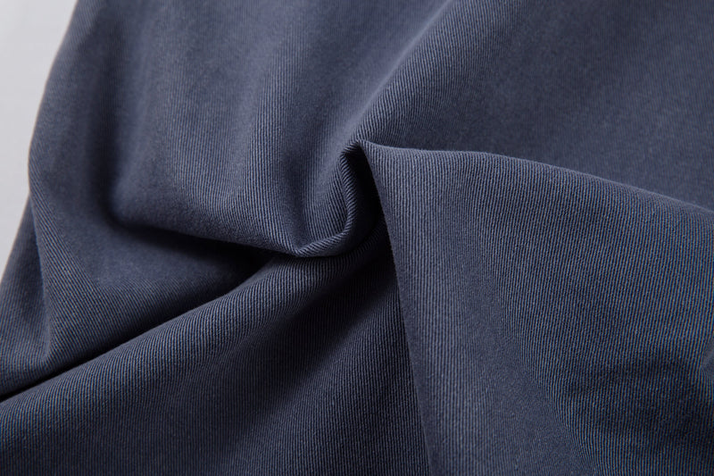 Close-up of blue denim fabric texture and drape