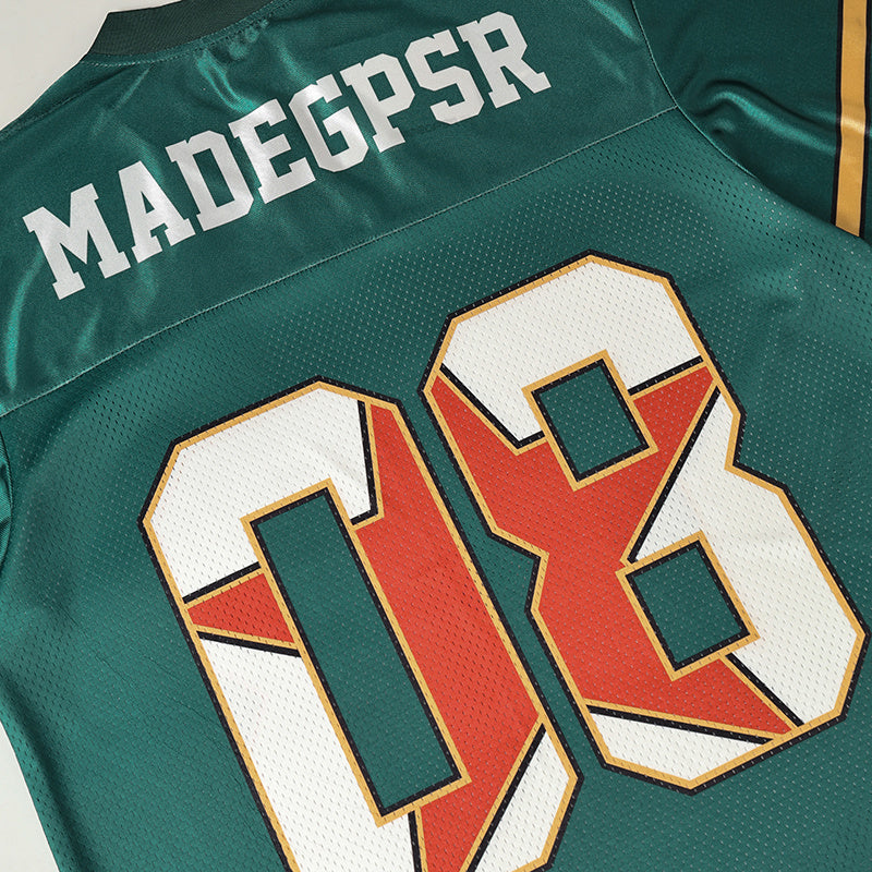 Green vintage-style football jersey with MADGPSR lettering and large number 08 on the back, streetwear design