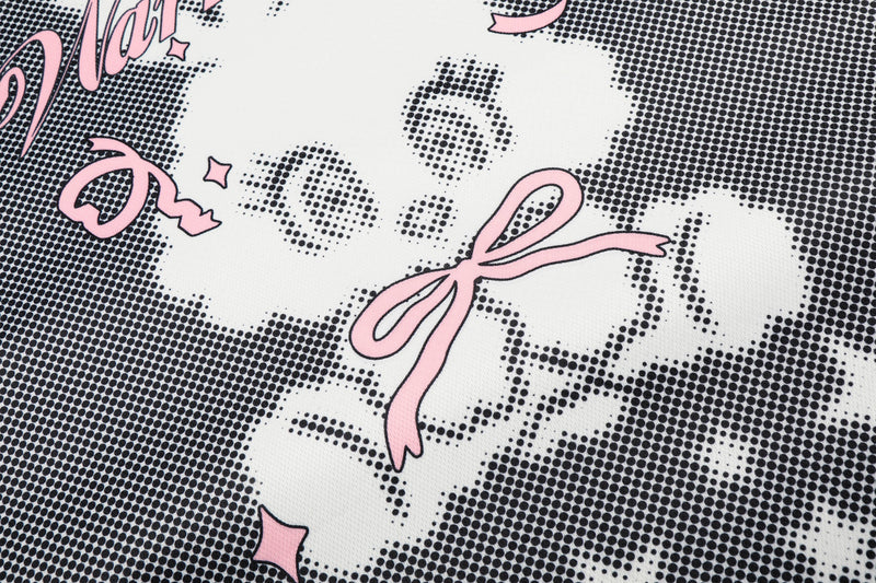 Close-up of black mesh jersey fabric with pink ribbon and cartoon bunny print in a bold streetwear design