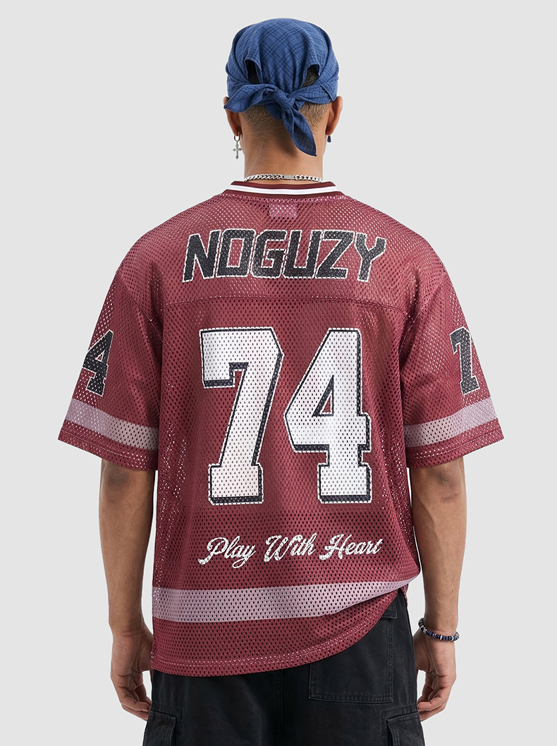 Maroon mesh jersey T-shirt with oversized 74 graphic and NOGUZY text on the back, styled in retro varsity streetwear
