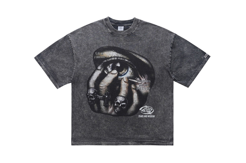 Dark washed oversized graphic tee with a surreal eye and skull print, featuring Tears and Wisdom streetwear artwork