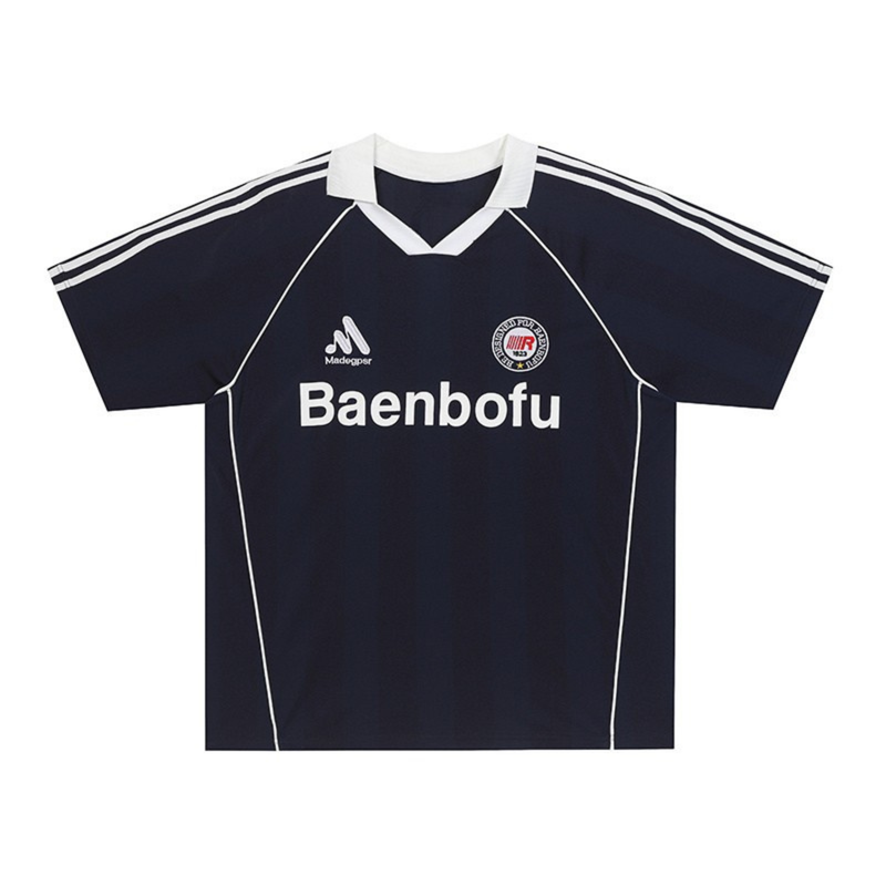 Black Baenbofu performance soccer jersey with white collar, stripe accents, and chest logo on a clean white background