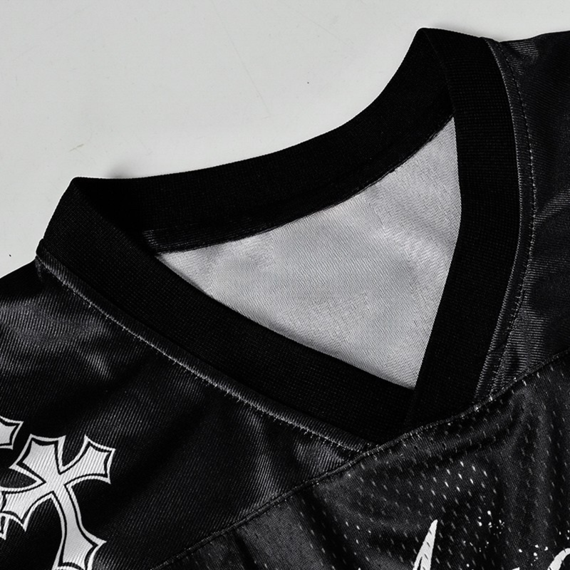 Black gothic football jersey with mesh collar detail and bold white cross graphic on the chest