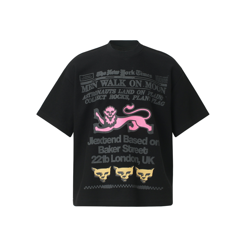 Black waffle tee with vintage newspaper-style graphics, pink lion print, and bold retro streetwear text on the front