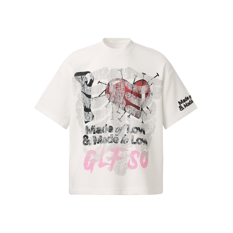 White oversized streetwear tee with distressed heart graphic and Made of Love text print on the front and sleeve