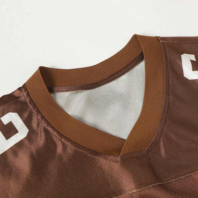 Brown varsity football jersey with ribbed V-neck collar and white number 66 details on the shoulders