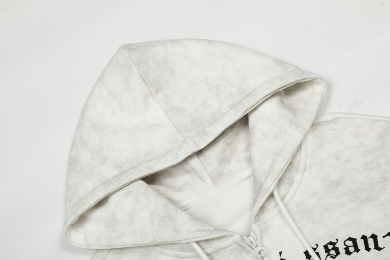 Close-up of white hood and shoulder seam with faded vintage wash texture