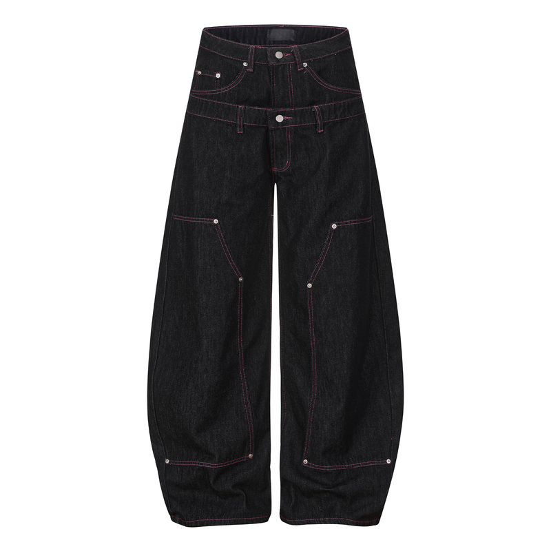 Front view of black wide-leg denim pants with pink contrast stitching and star details