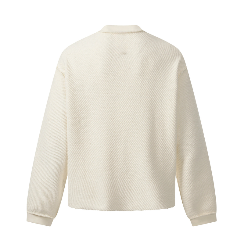 Back view of cream textured sweatshirt with plain panel and long sleeves