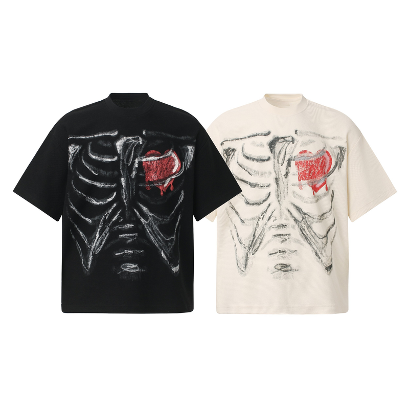 Black and cream graphic tees featuring a painted ribcage and dripping red heart design on the chest