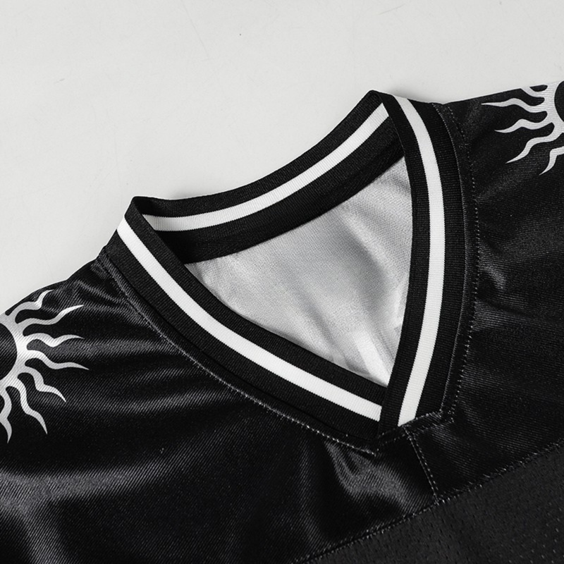 Black mesh football jersey with white striped ribbed collar and solar emblem graphic on the shoulder
