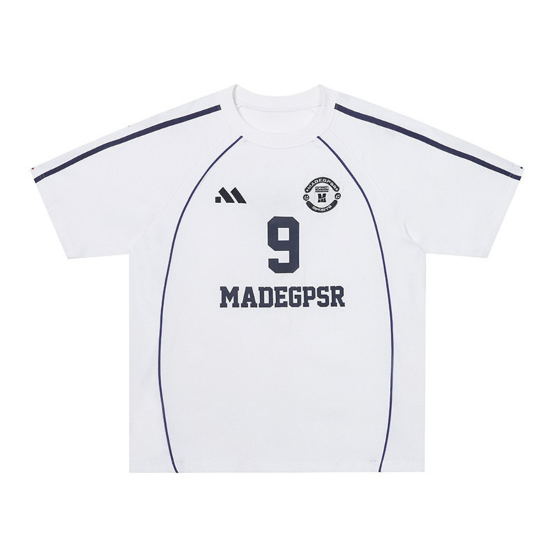 White football jersey t-shirt with navy trim, number 9, and MADEGPSR branding on the front