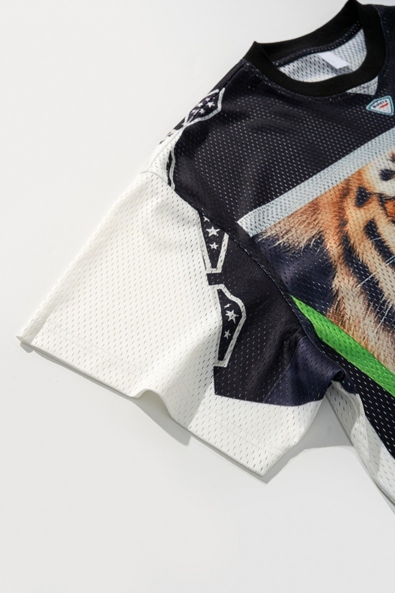 Black and white mesh jersey with tiger graphic, short sleeves, and green accent on a streetwear tee
