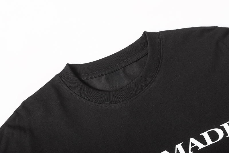 Close-up of black crew neck collar on a long sleeve tee